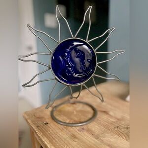 Vintage cobalt blue moon face and star sun rays metal ring candle holder.